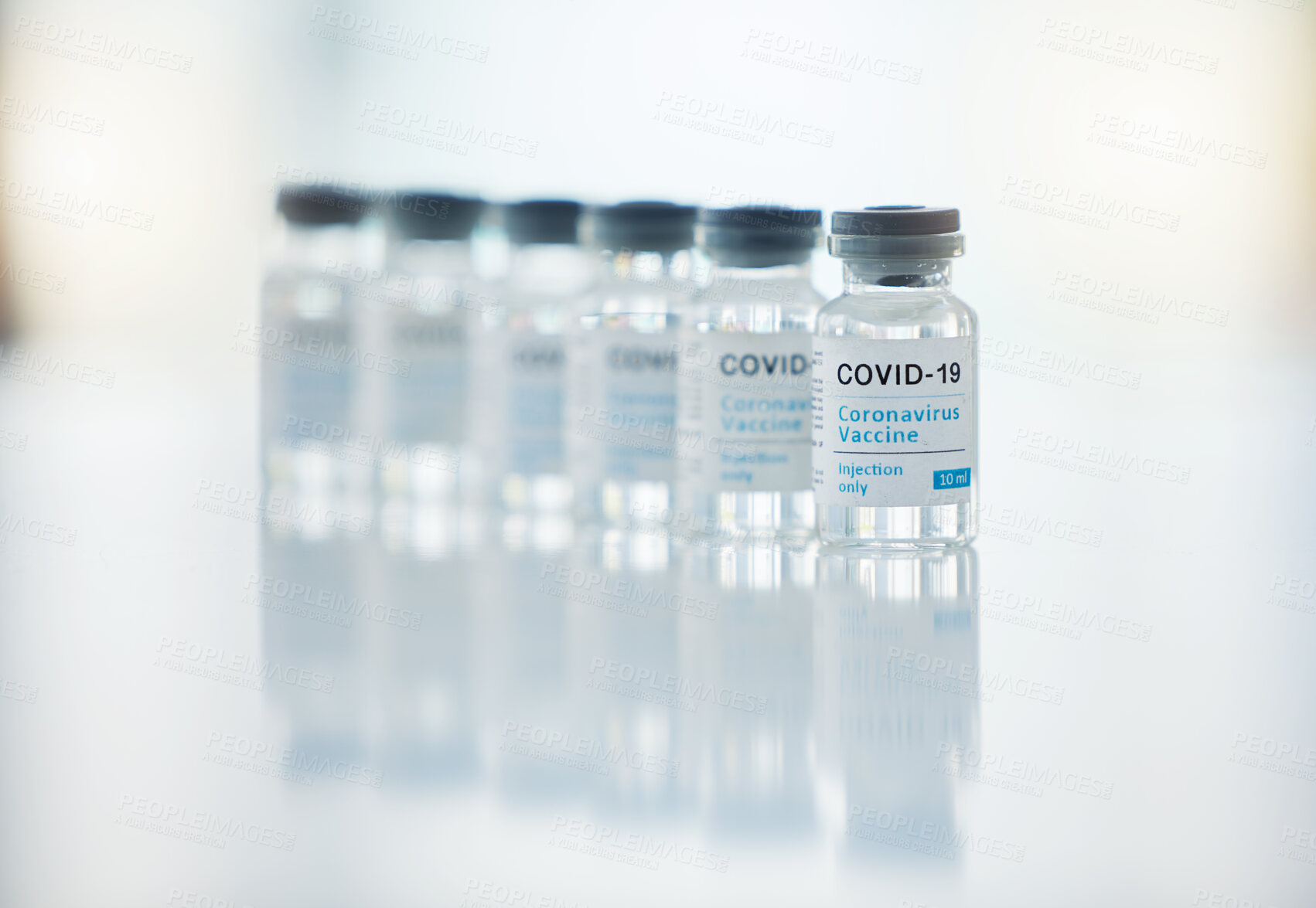 Buy stock photo Healthcare, medicine and covid vaccine bottle, stock and product in a hospital office. Healthcare with a virus cure, wellness or corona drug in a medical research clinic for safety from covid 19 