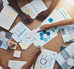 Meeting, top view and business people planning a strategy for a budget, marketing and creative advertising. Financial employees or workers hands working on branding, sales and management team goals