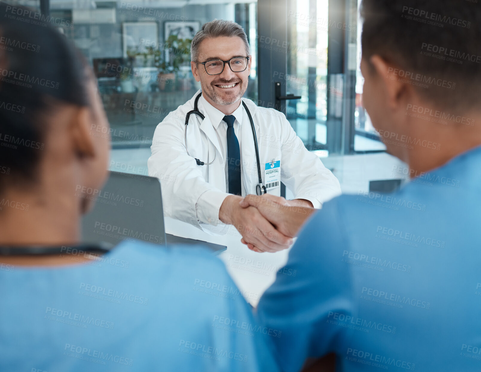 Buy stock photo Medical, handshake and meeting with doctor and nurse consulting together for planning, innovation and support in hospital. Communication, vision and goals with healthcare professional and thank you