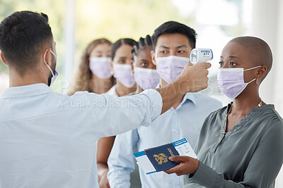 Buy stock photo Covid, passport and travel with black woman and security with thermometer check for healthcare, safety or vaccine certificate. Innovation, vacation and face mask with group of people in airport queue