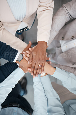 Buy stock photo Hands, collaboration and solidarity with a team of business people standing in a huddle or circle in the office from above. Teamwork, motivation and unity with a man and woman employee group at work