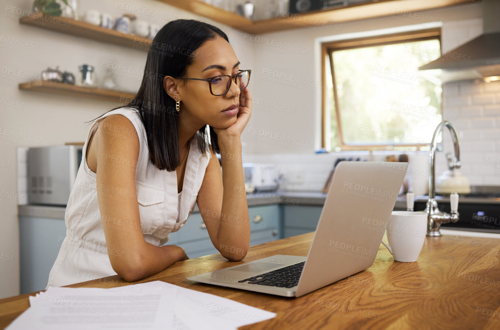 Buy stock photo Stress, burnout and laptop with woman in kitchen with mental health, tired or depression from remote work. Review, sad and research with bored girl reading email at home for news, idea and technology