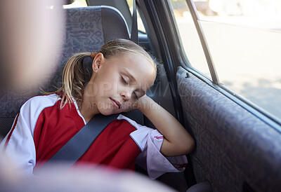 Buy stock photo Soccer, travel and girl sleeping in a car tired from sports practice, training and fitness workout for children. Transportation, relaxing and young kid resting and dreaming peacefully after football