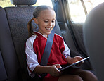 Happy, girl child and with tablet in car smile, browse online and use social media apps while buckled up. Female kid, use digital device or after practice, share winning soccer match or playing game 