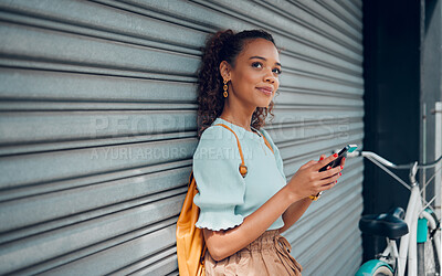 Buy stock photo City lifestyle, girl with phone and bike standing at wall thinking before writing text. Happy female student, bicycle and smartphone outside street, communication, 5g and sustainable urban transport.