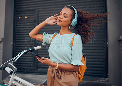 Buy stock photo Bicycle, phone and black woman on headphones in city streaming audio, music or podcast. Happy, travel and female from South Africa with bike, 5g mobile and listening to radio sound track on headset.