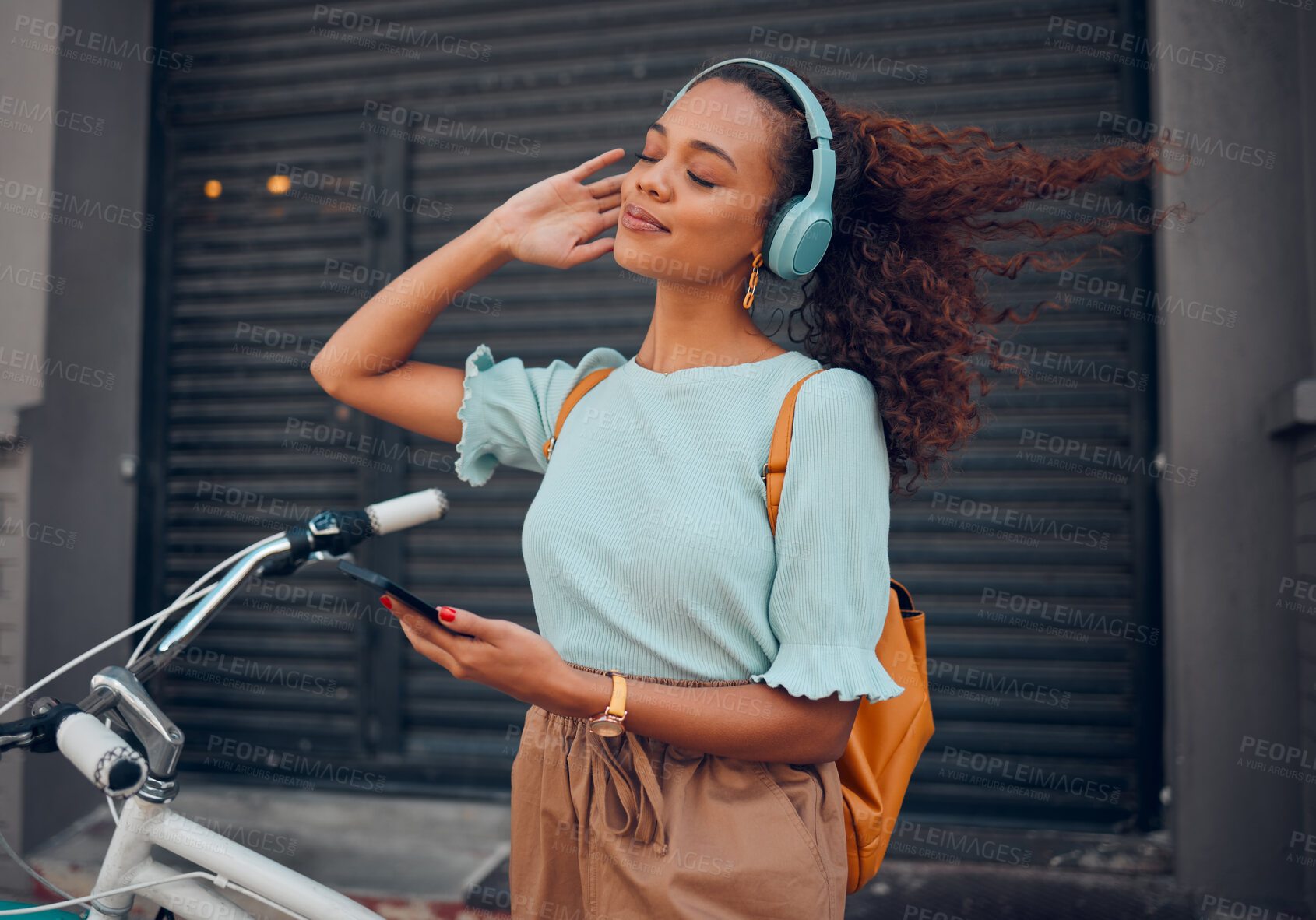 Buy stock photo Bicycle, phone and black woman on headphones in city streaming audio, music or podcast. Happy, travel and female from South Africa with bike, 5g mobile and listening to radio sound track on headset.