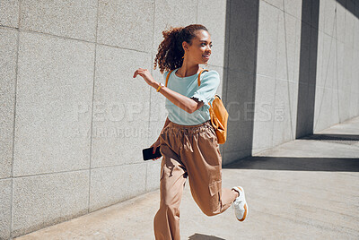 Buy stock photo Woman, travel and city with backpack, running and street for holiday, vacation or traveling. Black woman, tourist and outdoor in urban, metro or town in summer, sunshine and smile in Cape Town