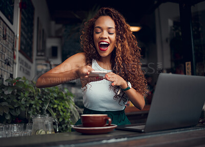 Buy stock photo Coffee shop, influencer and woman taking picture of coffee on phone and working on laptop. Happy young student with computer in cafe, taking photograph of drink on smartphone for social media post