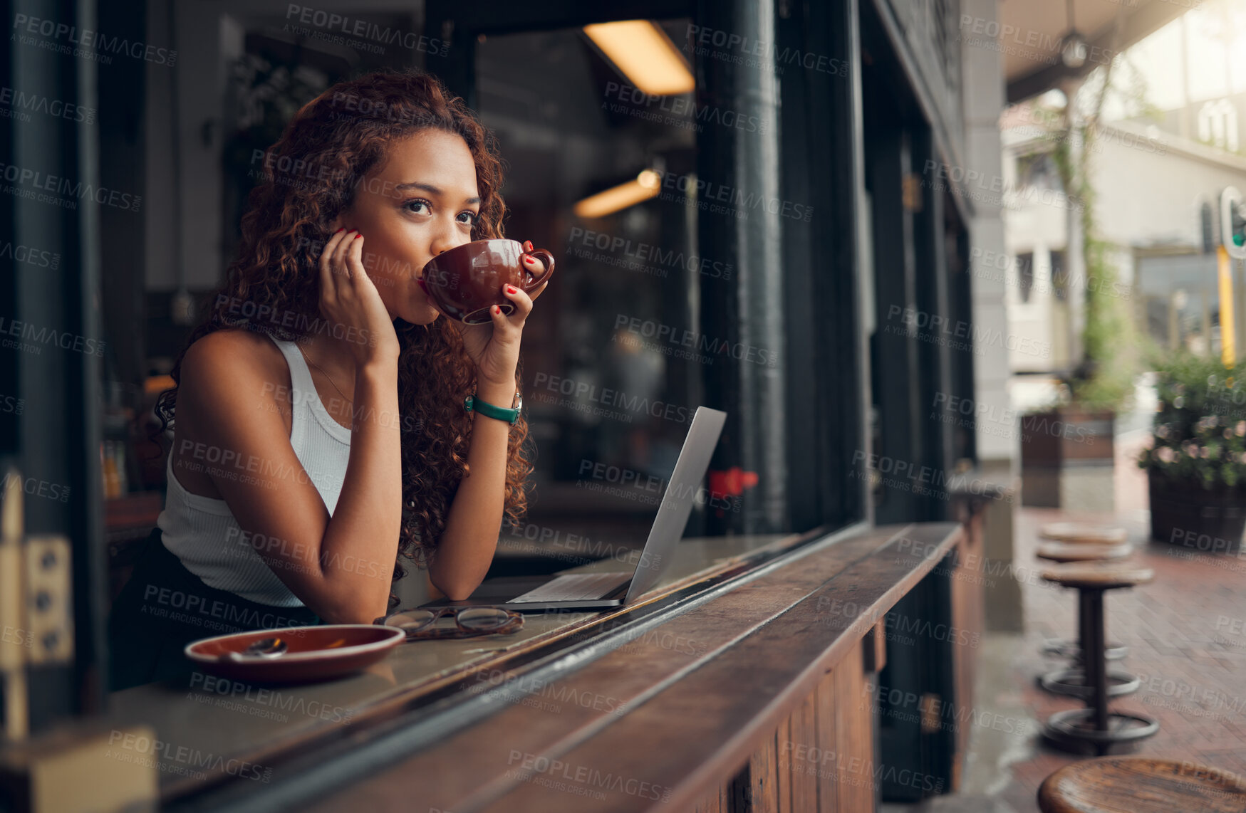 Buy stock photo Young woman, content and drink coffee at cafe for relax, peaceful and focused on work with laptop. Female, girl and hot beverage or tea in hand take a break, for lunch and thinking in coffee shop.