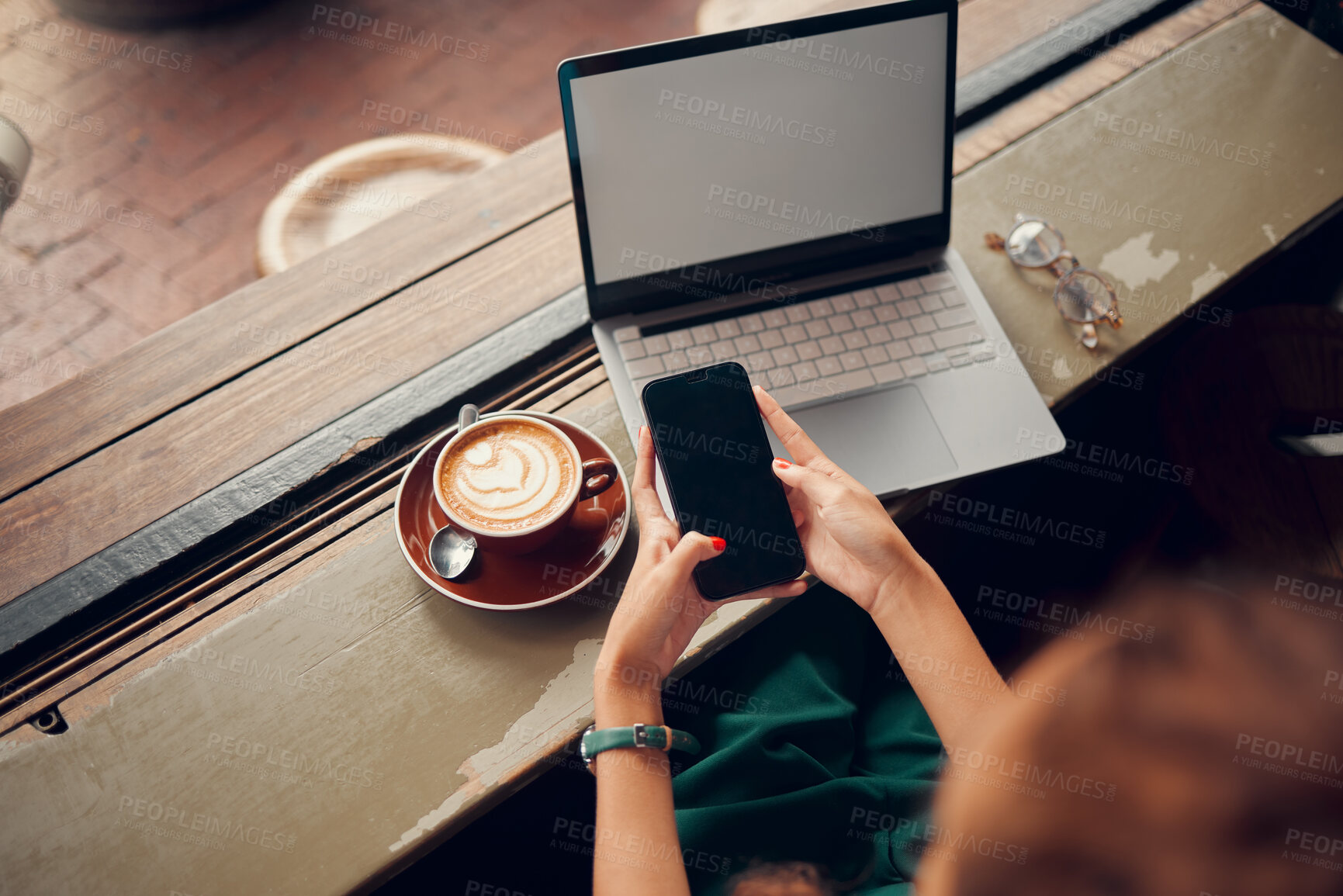 Buy stock photo Phone, laptop and coffee shop with a woman customer browsing social media or texting from above. Computer, coffee and email with a female consumer in an internet cafe for communication or networking
