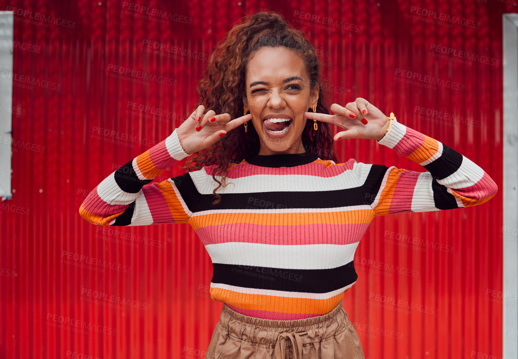 Buy stock photo Funny face, happy and black woman with a smile and tongue out with trendy fashion style against a red background. Crazy chic with comic expression while feeling silly, happy and playful outside