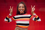 Peace sign, comic and black woman against red wall in the city of Amsterdam for holiday, travel and adventure. Thinking, fashion and young girl with crazy, and funny idea on vacation with smile