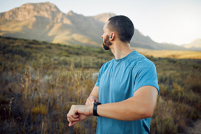 Fitness, man and runner with view of mountain in nature for healthy sport exercise or workout in the outdoors. Active athletic male training in sports run on a scenic route in the countryside outside