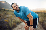 A tired runner, man on nature run for fitness exercise and marathon training cardio health workout. Sports athlete working out, running on natural dirt road and racing to train race sport competition