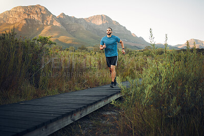 Buy stock photo Fitness, countryside or man running on path for sports exercise, marathon training or cardio workout for healthy body. Wellness lifestyle, mountain freedom or nature peace runner on calm morning run