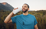 Runner, mountain nature and man drinking water after running. Break, relax and male from South Africa with refreshing liquid after training, workout or exercise on grass field for fitness or health.