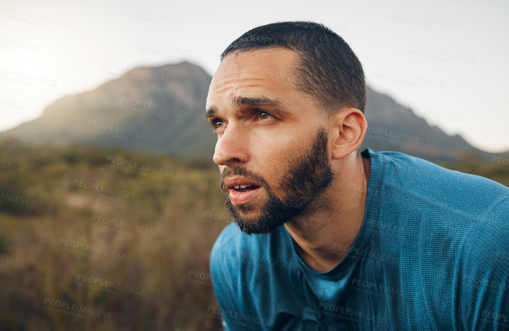 Buy stock photo Fitness, mountain and nature man tired after workout run, exercise or sports training for body, health or mindset wellness. Running motivation, countryside and marathon runner exhausted after cardio