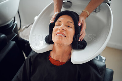 Buy stock photo Woman, hairdresser and hair care being relax, with head dry with towel after wash in basin. Salon, beauty spa and professional stylist with senior client, for hairstyle change and happy with service 