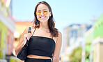 Portrait, asian woman and sunglasses with smile, happy and casual look in the city being edgy, trendy fashion and with handbag. Young girl, relax and confident female outdoor for fun in summer day. 