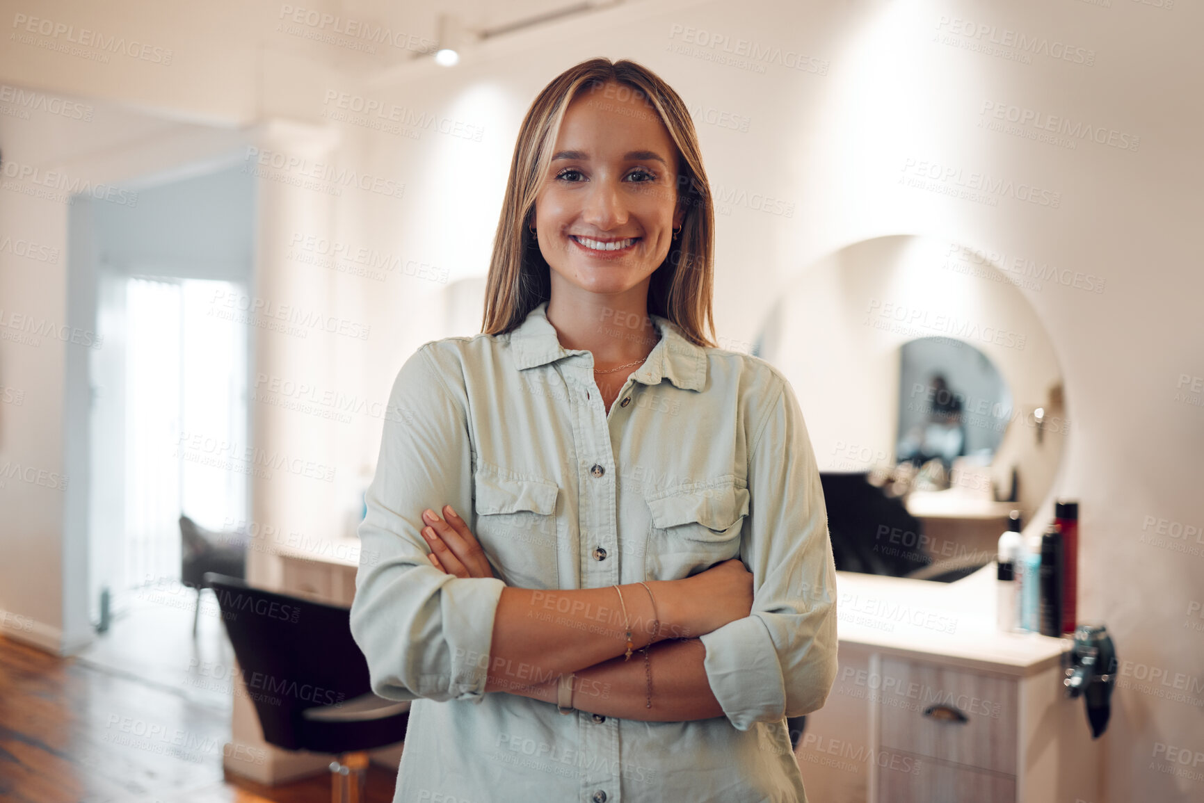 Buy stock photo Salon, small business and owner with a woman stylist standing arms crossed in her workshop. Hairdresser, startup and entrepreneur with a female beautician working in the beauty or hair industry