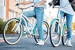 Couple, bicycle and legs in the street of a city for travel, exercise or adventure in the outdoors. Interracial man and woman on bikes for cycling tour in a urban town or traveling in South Africa