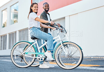 Buy stock photo Happy couple, bicycle and city street travel for exercise, fun or adventure outdoor. Black and asian tourist man and woman cycling for carbon footprint on bike in urban town traveling in South Africa