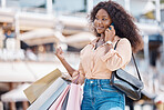 Retail shopping bag, phone call and black woman in city feeling happy with shopping experience. Fashion, sale and retail store purchase of female from Nigeria on 5g mobile, talking and smile outdoors