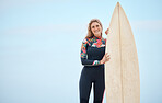 Blue sky, portrait and surfboard, surfer and woman ready to surf Costa Rica ocean waves on vacation or holiday. Fitness, health and female holding board for water sports, surfing or training exercise