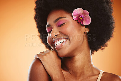 Buy stock photo Beauty, smile and cosmetic makeup skincare of a black woman with an orchid looking happy. Natural hair, calm and cosmetics of a person from Jamaica feeling beautiful, relax and happiness in her skin