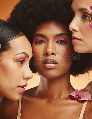 Buy stock photo Beauty, flower and group of women with makeup in studio, model for fashion, cosmetics and skincare. Diversity, beauty products and portrait of African girls face for spa, skincare and skin wellness