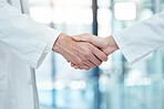 Handshake, doctors meeting or teamwork for partnership, collaboration or support for medical success in hospital. Healthcare, health or shaking hands for thank you, welcome or trust for surgery help