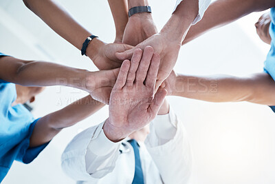 Buy stock photo Below, group and hands stack for medical, staff and teamwork in hospital for motivation. Team, doctor and nurse with hand for collaboration, healthcare and help in community at job together in clinic
