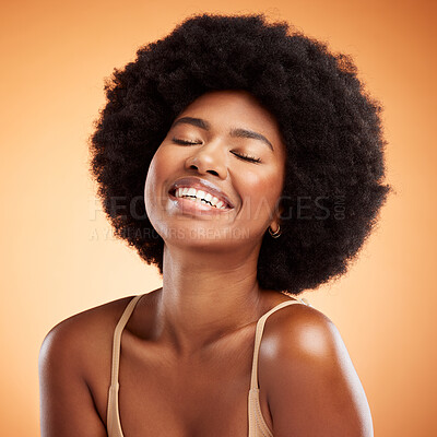 Black woman face, natural beauty and skincare health wellness on orange studio wall background. A happy african model smile, black female empowerment and healthy cosmetic luxury fashion afro haircare