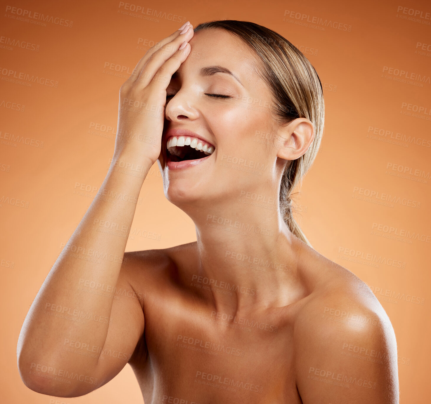 Buy stock photo Skincare, smile and woman at a spa for beauty against an orange mockup studio background. Excited, young and cosmetic girl model happy with face makeup, cosmetics and dermatology for her body