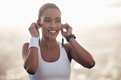 Buy stock photo Music, fitness and black woman training in the city with motivation from podcast for a run. Happy, smile and thinking athlete runner with the radio on earphones during workout and exercise in nature