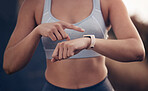 Fitness, time and woman runner with a smartwatch tracking running performance, heart rate and monitor training data. Sports, pointing and female athlete checking exercise or cardio workout progress 