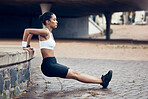 Woman in city, stretching for running exercise and start of morning fitness  routine training for cardiovascular health. Black woman athlete, stretch arm  muscle by wall and break after sports run Stock Photo