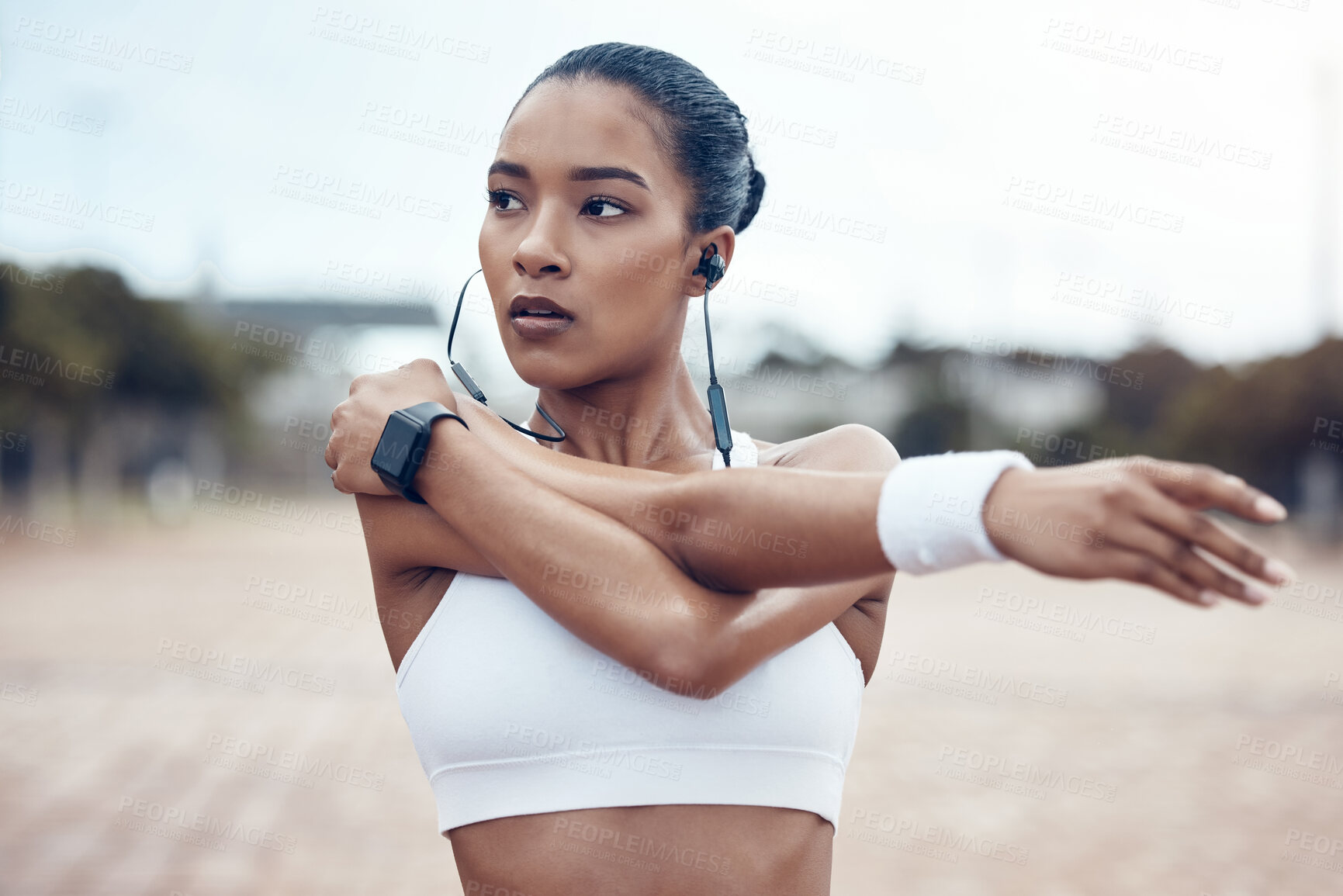 Buy stock photo Black woman, fitness and stretching, exercise and earphones, music and motivation for active lifestyle outdoors. African American, strong and focus, cardio and endurance, workout and healthy living.