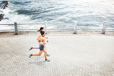 Buy stock photo Fitness friends, woman and running for exercise above in workout, training and cardio in South Africa. Active women in sports run together by the ocean in sea point for healthy exercising in nature