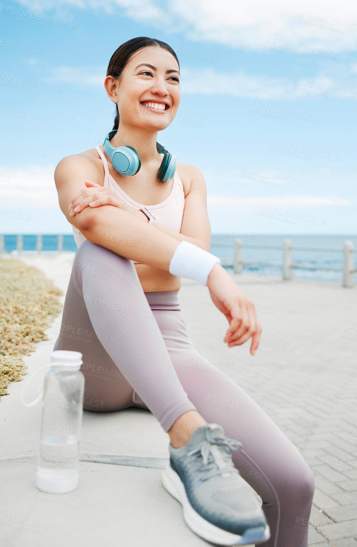 Buy stock photo Fitness woman, happy and beach exercise while taking break or rest while out running on promenade with a positive mindset, motivation and goal. Happy asian athlete girl runner outdoor for a workout