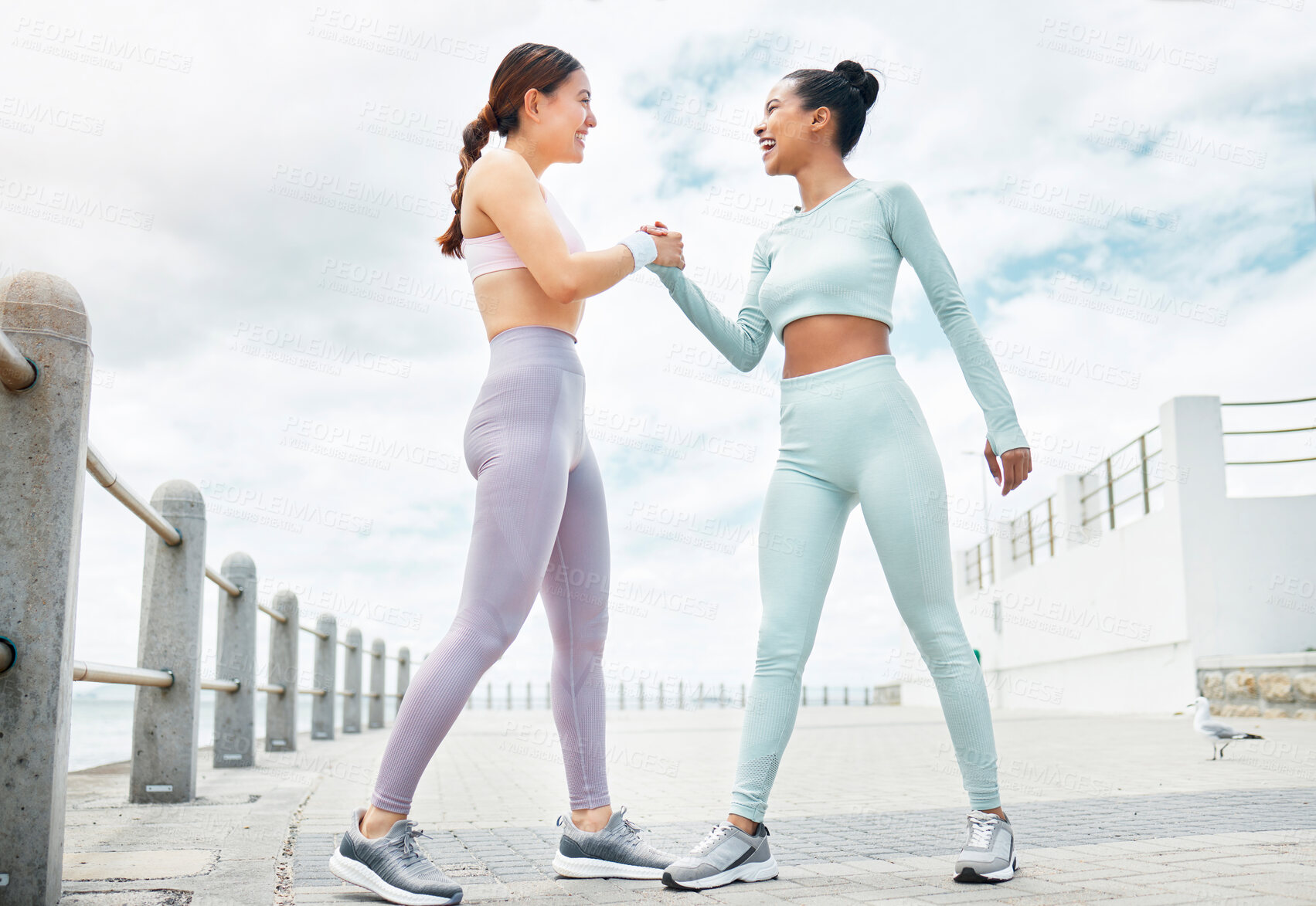 Buy stock photo Collaboration, fitness and exercise with sports friends shaking hands in motivation during a workout. Handshake, training and health with a female athlete and friend in celebration of a goal