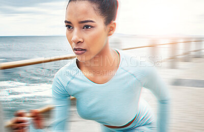 Buy stock photo Fast, fitness and woman running in nature for cardio health, wellness and sports motivation by the ocean. Face of an athlete runner with speed, training and doing a workout for exercise by the sea