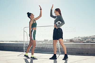 Buy stock photo Football, teamwork and high five with women on rooftop for winner, sports training or goals together. Fitness, soccer and exercise with athlete friends and support in workout, success and motivation