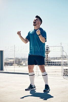 Buy stock photo Football, soccer player and athlete man in celebration after winning or scoring a goal at sports match or game in the city. Celebrate, win and champion player happy about performance in urban sport