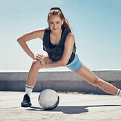 Woman, soccer and fitness stretching workout in city for football training  or healthy athlete. Portrait of athletic girl, sports exercise wellness  motivation and strong cardio stretch before game