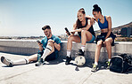Sport friends, phone and relax in city after exercise and morning cardio, physical exercise and soccer training. Fitness, soccer player and town hangout with diverse people talking after workout