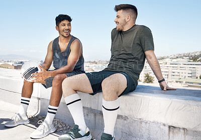 Buy stock photo Friends, sports and talking after soccer game on rooftop for urban sports, exercise and training outdoor in summer. Athlete men have conversation about fitness, football and city lifestyle with ball