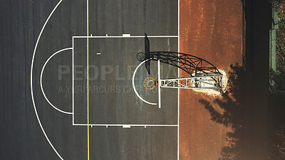 Buy stock photo Aerial background basketball court, sports playground and outdoor community turf for competition, training and ball game. Above basketball hoop, floor space lines and urban stadium pitch in sunshine