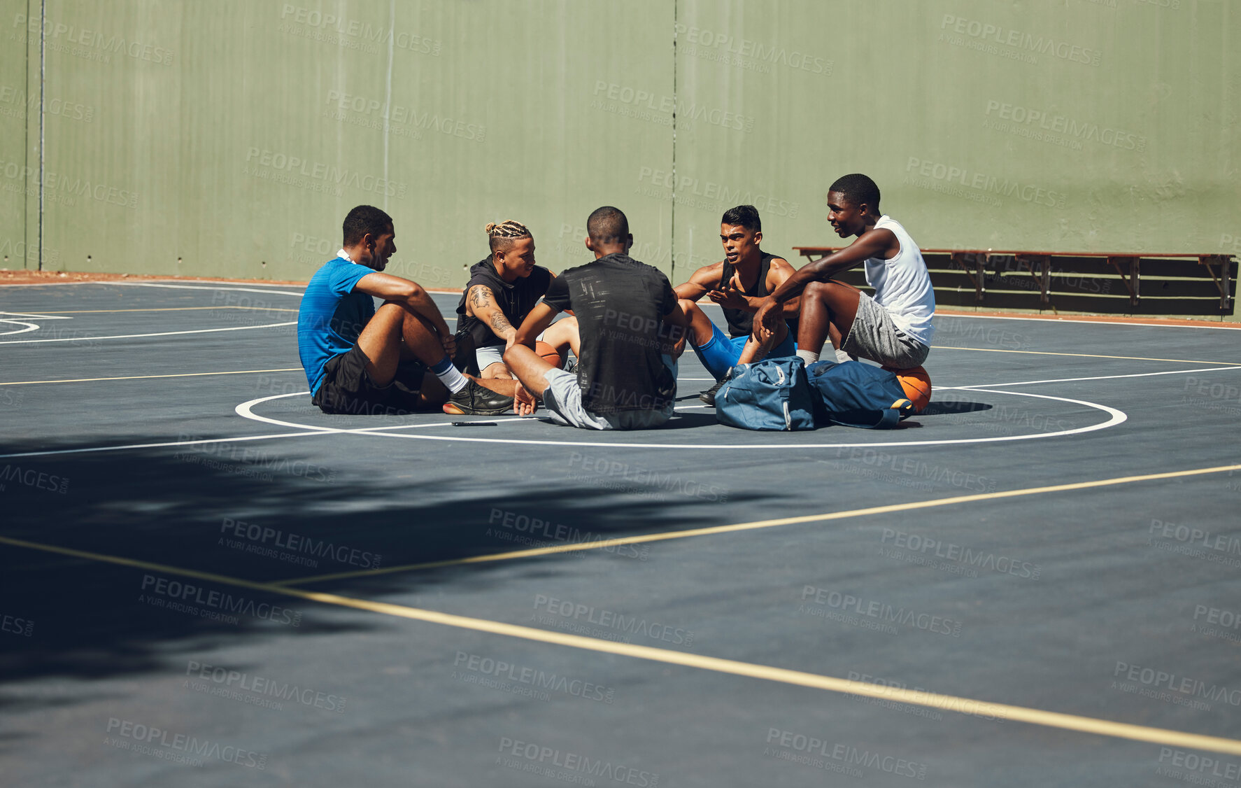 Buy stock photo Teamwork, basketball and planning with friends relax on sports court for training, workout and fitness together. Exercise, goals and health with athlete men relax after game competition in outdoor
